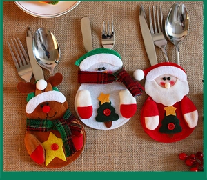 Detailed view of handmade Christmas cutlery holders with reindeer, snowman and Santa motifs