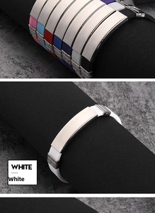 Detail view of colorful silicone wristbands with smooth engravable stainless steel plates