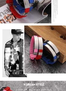 Close-up of colorful silicone bracelets with polished metal plates and adjustable straps
