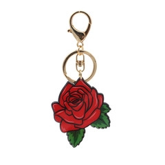 Detailed view of creative rose-shaped keychain with red petals, green leaves, and gold clasp