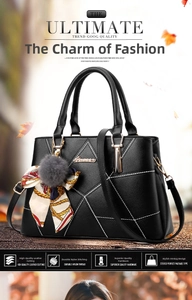 Detail of black leather handbag with white stitching, colorful scarf and fur ball charm