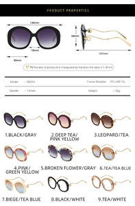 Detail of oval sunglasses with metal wave temples and pearl accents on the hinge