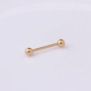 Close-up of golden 316L stainless steel barbell piercing stud with polished finish