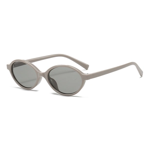 Chic oval cat-eye sunglasses with glossy beige plastic frames and dark grey lenses