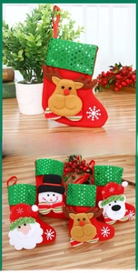 Detail of four festive red sequined Christmas stockings with 3D reindeer and snowman