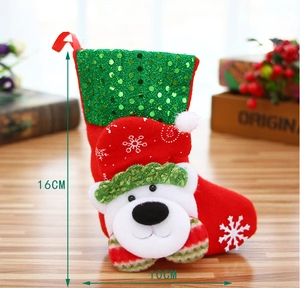 Detail of 16cm Christmas stocking with sequined green top and 3D polar bear ornament