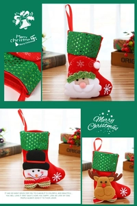 Detail of Christmas stockings with Santa, snowman, deer designs and green sequin cuffs