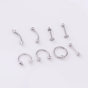Detailed set of 8 silver stainless steel body piercing jewelry for lips and nose