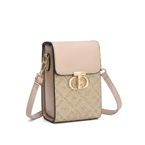 Detailed view of the apricot square crossbody bag with monogram pattern and gold chain