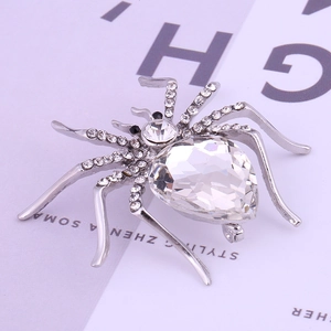 Spider brooch in silver finish with a large water drop crystal and white rhinestones