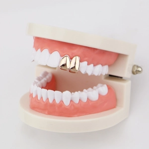18K gold plated hip hop single vampire fang grillz shown on a dental model accessory