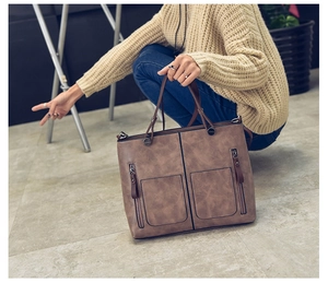 Brown vintage PU leather tote bag with dual front zipper pockets and detachable strap