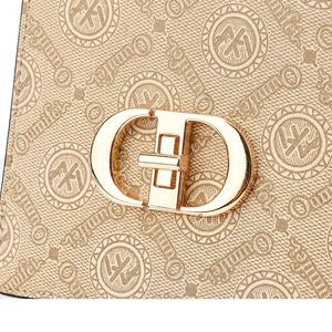 Detail of pink and brown crossbody bags with Oumifer textured fabric and gold lock