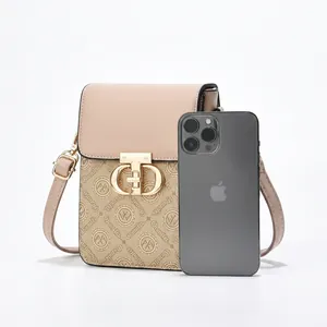 Detailed view showing crossbody phone bag capacity with iPhone, power bank and essentials