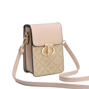 Detail of beige mini crossbody bag showing storage capacity for phone and essentials