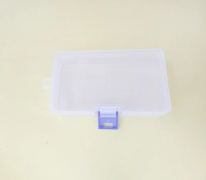 Detailed view of rectangular transparent plastic storage box with blue security latch