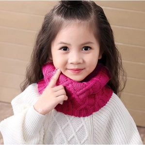 Kids knitted infinity scarf in rose red featuring a chunky cable knit pattern for winter