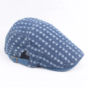 Vintage distressed denim flat cap for women featuring retro ripped holes and adjustable strap