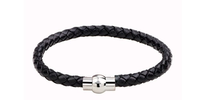 Detail of a braided black leather men's bracelet with a polished silver magnetic clasp