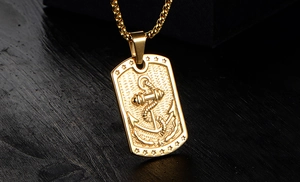 Detail of gold 316L stainless steel necklace featuring anchor and star engraved pendant