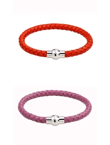 Detail of red and purple braided leather bracelets with round silver magnetic clasps