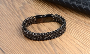 Detail shot of black stainless steel woven chain bracelet with durable snap clasp