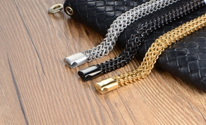 Detail of woven stainless steel men's bracelets in gold, silver, and black with magnetic clasps
