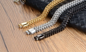 Detailed view of layered titanium steel bracelets with magnetic clasps in gold, silver, and black