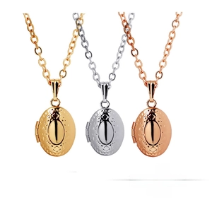 Detailed view of three oval floating lockets in gold, silver, and rose gold with relief texture