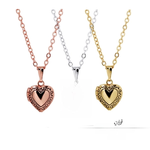 Three-piece heart locket necklace set in gold, silver, and rose gold with floral engraving