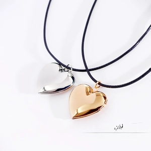 Polished heart locket necklaces in gold and silver finish with sleek black cord