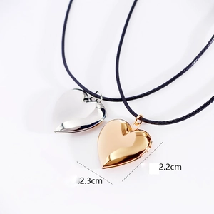 Polished heart locket necklaces in gold and silver finish with black cord strings