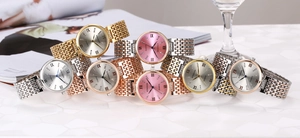 Detail view of stylish women quartz watches with diamond scales and elegant steel bands