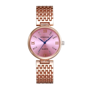 Close-up of pink dial watch with rose gold strap and sparkling crystal hour markers