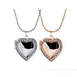 Detailed macro view of heart-shaped floating lockets in silver and rose gold finish