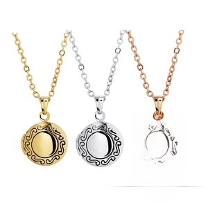 Detailed view of round floating lockets in gold, silver, and rose gold with wavy edges