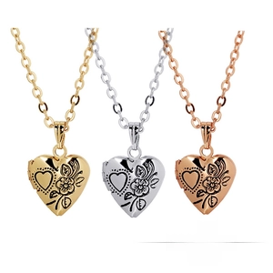 Detailed engraving on heart-shaped floating lockets in gold, silver, and rose gold finishes