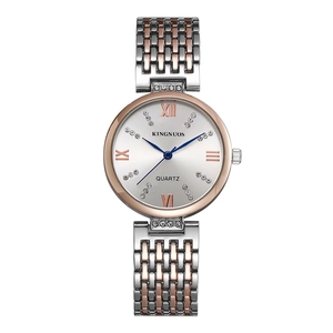 Detailed macro view of crystal-set bezel and silver dial with Roman numerals on watch