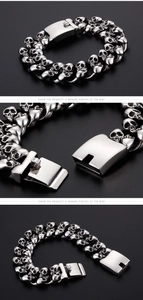 Detail view of gothic skull link bracelet in polished stainless steel with box clasp