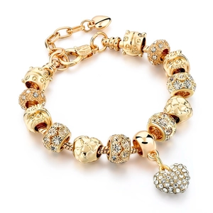 Golden snake chain bracelet with sparkling crystal heart charms and owl beads