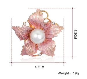 Detailed view of a pink floral brooch with pearl center and 4.5cm dimension markings