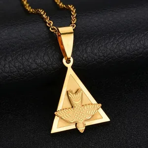 Detail of gold plated stainless steel triangle pendant with flying bird relief carving