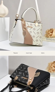 Detail of elegant two-tone handbags with metallic leaf charms and pearl accents