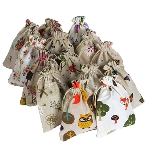 Assorted cotton linen drawstring bags featuring various animal and floral patterns