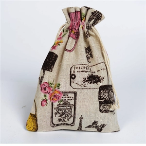 Detailed view of burlap drawstring pouch with vintage Paris Eiffel Tower and rose print
