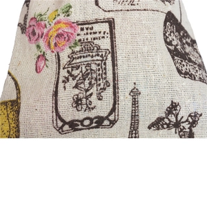Close-up of vintage cotton bag with rose and Eiffel Tower patterns and fabric texture