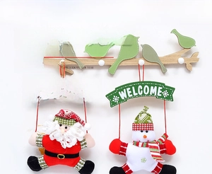 Detail of fabric Santa and Snowman hanging decorations with Welcome sign for Christmas