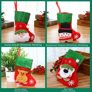 Detail of Christmas stocking ornaments featuring sequins and festive 3D character appliques