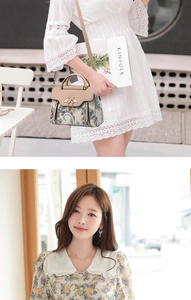 Détail du sac à main à motif paisley avec boucle oiseau dorée et bandoulière cuir