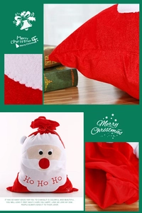 Detail of plush Santa gift bag showing 'Ho Ho Ho' embroidery and drawstring closure